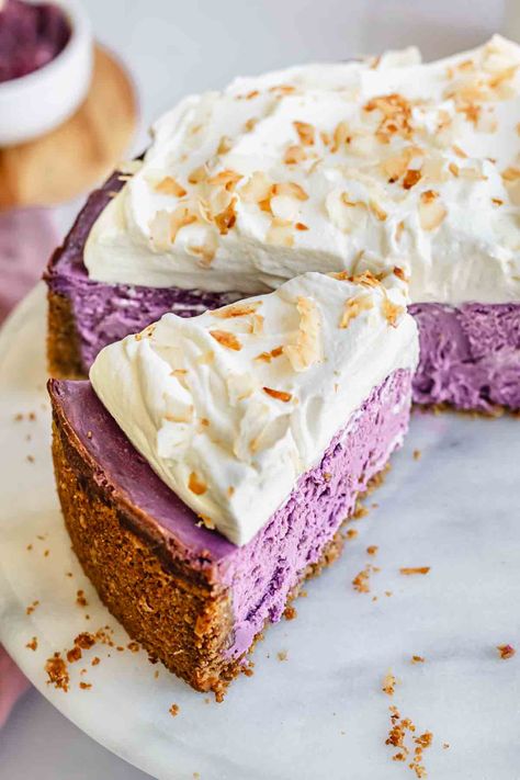 Ube cheesecake is a deeply vanilla-flavored purple cheesecake made with a graham cracker coconut crust and coconut whipped cream. This purple yam cheesecake has the subtle nutty, marshmallowy flavors of ube, creamy texture, and a stunning purple hue from two forms of ube in the filling. Cheesecake Desserts Recipes, Food For The Gods, Vanilla Marshmallows, Plum Recipes, Cheesecake Cups, Homemade Cheesecake, Baking Business, Coconut Whipped Cream, Cheesecake Desserts