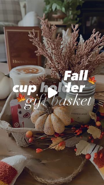 Ashley Hughes on Instagram: "Here’s a fall🍁 inspired version of my viral “cup holder” gift basket!

The perfect “thinking of you” gift for any birthday, wedding, shower, get well etc!

I love to place some kind of florals, candle, gift card & drink into each holder🫶🏻

Also… the @antiquecandleco_ candles fit PERFECTLY inside these cardboard cup holders & they just released a ton of fall scents!! (they are linked in my bio!)👆🏻" Cup Holder Gift Basket, Drink Holder Gift Basket, Cup Holder Gift Idea, Cup Holder Ideas, Fall Gift Basket Ideas, Fall Basket Ideas, Ashley Hughes, Drink Basket, Gift Card Bouquet