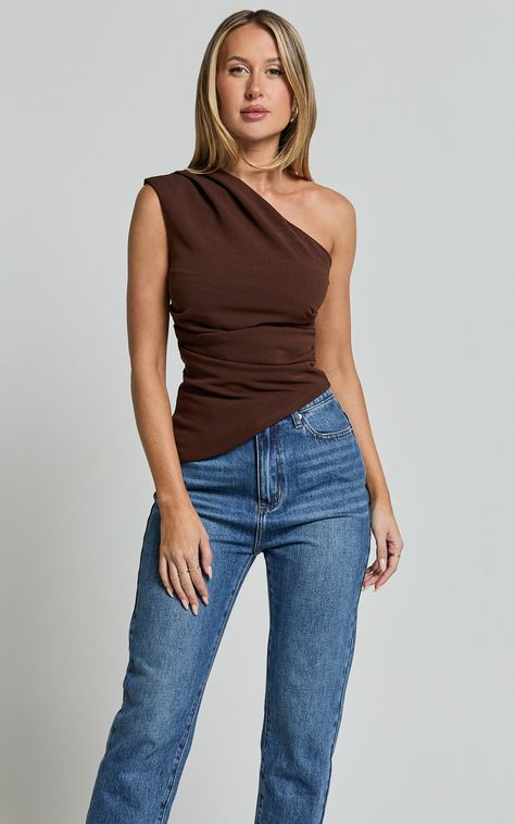 Get ready to turn heads at your next party with the Amal Top - an asymmetrical one-shoulder gathered top in a delicious chocolate brown hue. Made from soft jersey fabric and crafted with polyester, this fashion-forward piece is designed to make you feel confident and empowered all night long. With its sleeveless design and standard fit, this top is perfect for showing off your unique sense of style while remaining comfortable. Pair it with your favorite jeans or a sleek skirt for a look that's e Jeans And Cute Top Outfit Summer, Chocolate Top Outfit, Brown And Jeans Outfit, Brown Off Shoulder Top Outfit, Jeans And Brown Top, Brown Top Outfit Ideas, Argentina Outfit, Asymmetrical Top Outfit, Psychologist Outfit