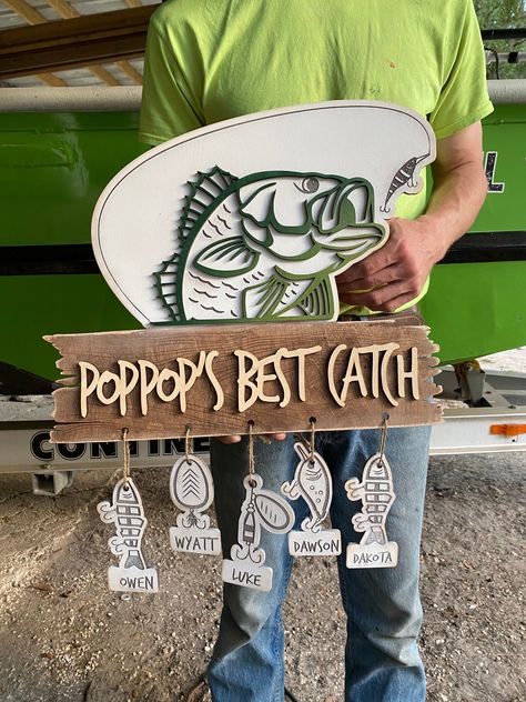 "This unique and customizable laser cut wooden sign is a perfect gift for your fisherman Dad or Grandpa! Consists of 3 sizes to choose from. XL- 22\" x 19\" AS SHOWN IN PICTURE L- 17\"x14.5\" M-12.7\"x 10.8\" size includes the hanging fish    personalized fish (up to 12)." Grandchildren Sign, Personalized Wooden Signs, Laser Cut Wood Crafts, Laser Engraved Ideas, Father's Day Diy, Fishing Theme, Fathers Day Crafts, 3d Laser, Decoration Inspiration