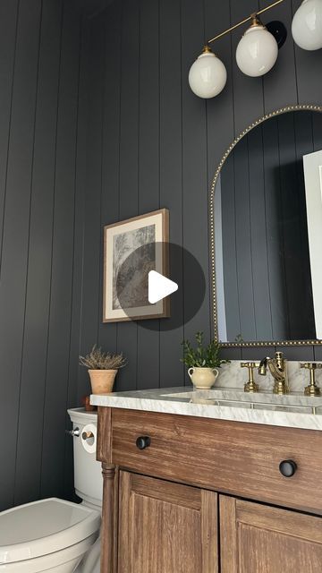 Leah White | Home Design & Decor on Instagram: "There is nothing like a moody powder bath to me! 😍 It transcends trends, in my humble opinion. Plus, if you love it, who cares if it’s in or out! I love vertical shiplap and knew I wanted to incorporate it into our powder bath, using a moody paint color with just the right amount of depth 😍 I love it combined with the warm wood vanity, marble countertop and mixed metals. I am still searching for the perfect artwork for all of my spaces including this one, but all in good time! Loving the way this moody but simple space looks for now. 🫶🏻 SAVE this post for powder bath details and follow along as we make our house a home 🤍 Powder Bath details ✨ Walls -6 inch vertical Shiplap Paint - Sherwin Williams Peppercorn Vanity, plumbing, and towel r