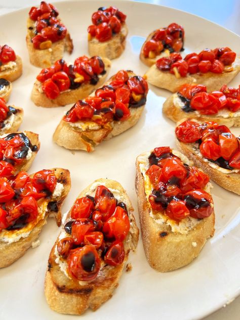 This Boursin Cheese Roasted Tomato Bruschetta appetizer features slices of a baguette, toasted with a little olive oil, then slathered with creamy Garlic with Fine Herbs cheese spread. Cherry Tomatoes are roasted with sliced garlic until they are soft and super sweet. A drizzle of balsamic glaze is a final flourish. These appetizers disappeared in minutes, among our guests. Boursin Cheese Bruschetta Dip, Boursin Bruschetta Dip, Boursin Bruschetta, Boursin Cheese Recipes Appetizer Ideas, Cheese Olives Appetizer, Boursin Cheese Appetizers, Roasted Tomato Bruschetta, Brushetta Appetizers, Boursin Appetizers