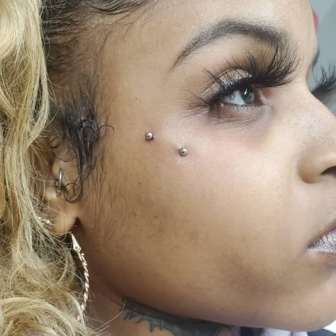 Types of Face Piercings: Everything You Need to Know Types Of Dermal Piercings, Womens Facial Piercings, Surface Face Piercing, Face Peircings Women, Upper Cheek Piercing, Face Dermal Piercing Cheek, Cheek Piercing Upper, Double Dermal Piercing Face, Cute Facial Piercings For Women