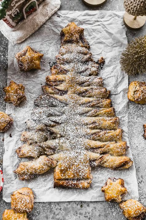 Is there anything more festive for a holiday party than a whimsical Christmas Tree Puff Pastry? Our version is stuffed with a simple but infinitely flavorful almond and cream cheese paste, tangy raspberry jam and just enough powdered sugar to satisfy even the most discerning palate. Christmas Tree Pastry, Tree Puff Pastry, Christmas Tree Puff Pastry, Cheese Paste, Sweet Puff Pastry, Cream Cheese Puff Pastry, Easy Christmas Tree, Whimsical Christmas Tree, Pastry Appetizer