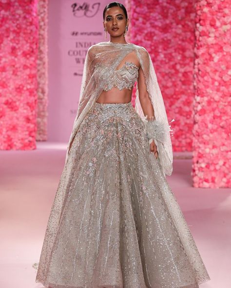 "Coralie" Cocktail Lehenga Powdery sage shimmer tulle structured lehenga accentuated with thread work and hand crystal beading, paired with bustier choli and draped tulle dupatta - highlight is the feather engulfed cuff on dupatta. Available at Delhi and Mumbai Store. Jewellery Partner: @shailjas_naturaldiamonds Shoe Partner: @venussteps Gift Partner: @smokelabofficial Celebration Partner: @cedarclubhouse Photography : @gesuseth @hyundaiindia @reliancebrandsitd @lotus_herbals #FDCI #Hyun... Cocktail Lehenga, Shimmer Lehenga, Reception Outfit, Royalty Aesthetic, Indian Bridal Fashion, Desi Fashion, Wedding Service, Thread Work, Bridal Fashion