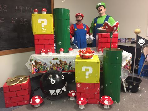 Super Mario Themed Halloween Booth. Mario Float Ideas, Super Mario Parade Float, Mario Parade Float, Mario Homecoming Float, Super Mario Float, Super Mario Trunk Or Treat Game, Trunk Or Treat Mario Kart, Mario Halloween Trunk Or Treat, Super Mario Bros Parade Float