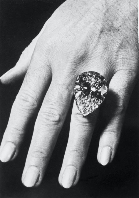 Known as the Taylor-Burton Diamond, this pear-shaped diamond was originally set as a diamond ring, but Taylor reset it into a diamond necklace because the ring was too heavy on her finger (imagine!!) | Elizabeth Taylor | Elizabeth Taylor diamond | Elizabeth Taylor jewels | Elizabeth Taylor jewelry | Elizabeth Taylor style | Elizabeth Taylor and Richard Burton Elizabeth Taylor Ring, Elizabeth Taylor Style, Elizabeth Taylor Diamond, Elizabeth Taylor And Richard Burton, Elizabeth Taylor Jewelry, Richard Burton, Pear Ring, Big Diamond, Elizabeth Taylor