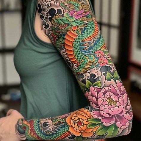 Detailed dragon full sleeve tattoo with peonies and floral elements, showcasing rich colors and intricate design. Ideal inspiration for artistic body ink enthusiasts. Japanese Half Sleeve Tattoo Design Women, Full Color Sleeve, Flower Arm Tattoos, Traditional Japanese Dragon, Dragon Tattoo Arm, Dragon Sleeve, Chinese Dragon Tattoos, Japanese Dragon Tattoo, Traditional Sleeve