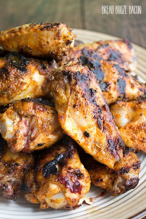 Grilled Cajun Chicken Wings are perfect for serving a crowd! Easy to make and loaded with flavor, they're sure to become your favorite wing recipe! #BreadBoozeBacon #grilling #chickenwings #cajun Mardi Gras Wings, Cajun Wings Recipe, Cajun Chicken Wings, Cajun Wings, Mardi Gras Party Food, Mardi Gras Recipes, Bread Booze Bacon, Outdoor Cooking Recipes, Wing Recipe