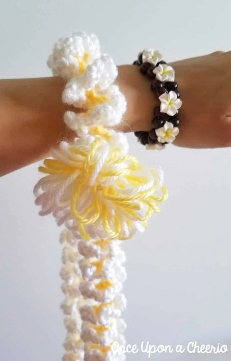 Hawaiian Plumeria Lei Free Crochet Pattern Plumeria Lei, Knitting Quilt, Hawaiian Leis, Yellow Yarn, Hawaiian Plumeria, Hawaiian Lei, Graduation Leis, Most Popular Flowers, Popular Flowers