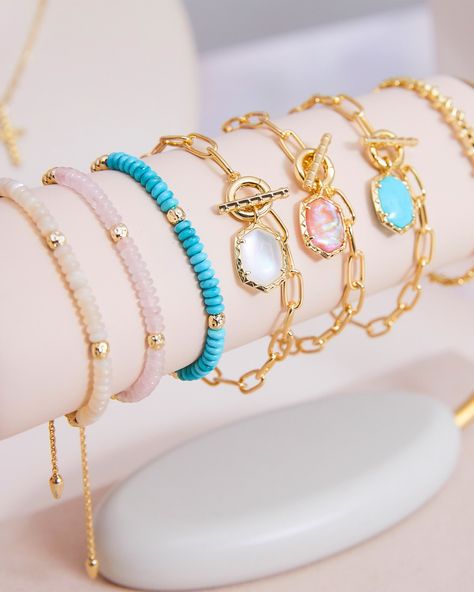 If you’re looking to shake up your bracelet stack, look no further than the Daphne Gold Link and Chain Bracelet in Variegated Turquoise Magnesite. With its paperclip chain, and detailed toggle closure, this bracelet does it all. Pair it with the Daphne Link and Chain Necklace for a chic, coordinated look. Metal 14k Yellow Gold Over Brass Material Variegated Turquoise Magnesite Closure Toggle Size 6.5"Inner CircumferenceDue to the one-of-a-kind nature of the medium, exact colors and patterns may vary slightly from the image shown. | Kendra Scott Daphne Gold Link and Chain Bracelet in Variegated Turquoise Magnesite | Variegated Magnesite Beachy Bracelets, Wrist Stack, Kendra Scott Bracelet, Preppy Jewelry, Gold Link Chain, Gold Link, Stacked Jewelry, Gold Band Ring, Jewelry Lookbook