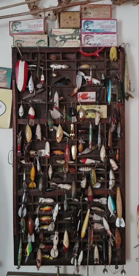 My husband's fishing lure collection ranging from 1930's-1960's! Vintage Lure Display, Fishing Lure Decor, Cottage Bunkie, Fishing Lures Display, Fishing Gear Storage, Video Mood, Old Fishing Lures, Gear Storage, Monster Fishing