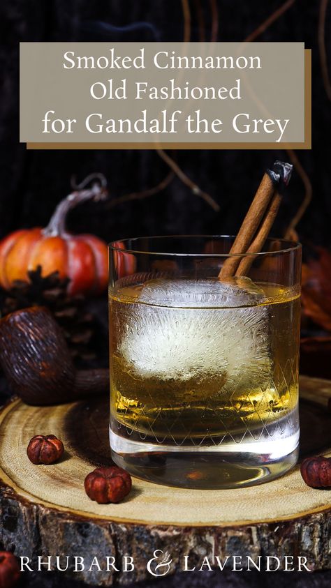 This smoked cinnamon old fashioned is the perfect drink to enjoy seated next to Gandalf the Grey, on a crisp Autumn evening, around a fire with a smoking pipe. Fall-inspired old fashioned cocktail, perfect for a Lord of the Rings themed party or a cozy night in! Thanksgiving Old Fashioned, Lotr Drinks, Bar Drink Recipes, Cinnamon Simple Syrup, Gandalf The Grey, Old Fashioned Cocktail, Cocktail Desserts, Old Fashioned Glass, Bar Drinks