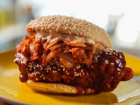 Jeff loves Korean food. This dish is an homage to Korean-style fried chicken and staple spicy Korean ingredients like gochujang and gochugaru. Gochujang Chicken Sandwich, Korean Chicken Sandwich, Gochujang Glaze, Grilled Chicken Sandwich Recipes, Korean Ingredients, Hot Sandwiches, Jeff Mauro, The Kitchen Food Network, Crispy Chicken Sandwiches