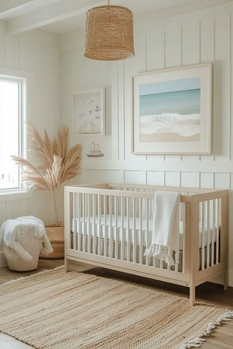 Create a soothing nursery with Cali coastal decor, focusing on soft pastels and sea-themed motifs. The room uses plush textures and whimsical oceanic decor to craft a peaceful, engaging environment for your little one. Safety and comfort are prioritized with natural wood furniture and washable soft rugs, making it an ideal space for rest and play. Discover how to design a wave-themed nursery by tapping here. Green Ocean Nursery, Nursery Surf Theme, Beach Inspired Nursery, Boho Nautical Nursery, Gender Neutral Beach Nursery, Coastal Grandma Nursery, Beach Themed Nursery Neutral, East Coast Nursery, Beach Themed Nursery Boy