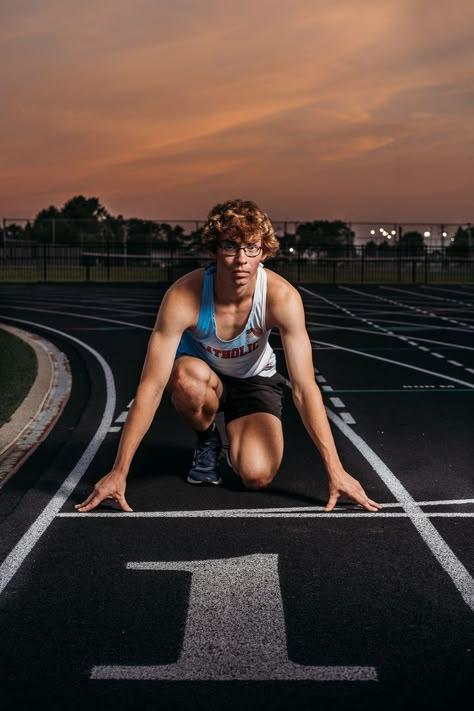 Track Senior Banner, Senior Boy Track Pictures, Senior Picture Ideas For Guys Track, Track Senior Banner Poses, Senior Photos Track And Field, Senior Track Picture Ideas, Cross Country Senior Pictures Boys, Sports Poses Photography, Track Pictures Poses Photo Ideas