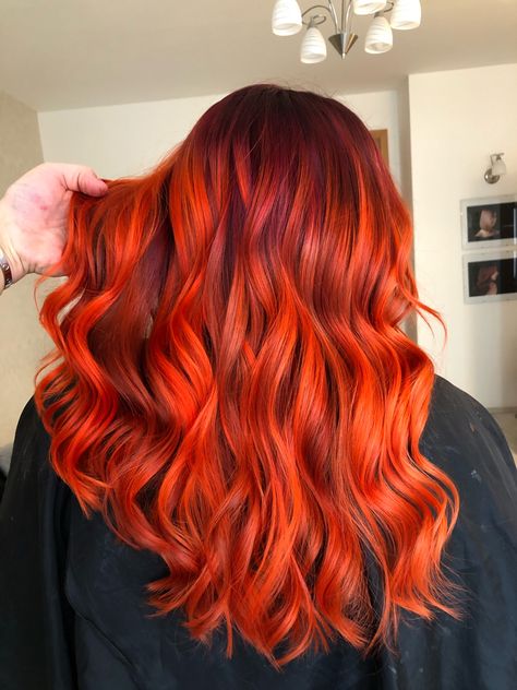 Vivid Hair Color Orange, Bright Orange Balayage, Orange Vivid Hair, Fiery Orange Hair, Vivid Orange Hair, Red Orange Balayage, Dark Red And Orange Hair, Red Hair With Orange Highlights, Deep Orange Hair