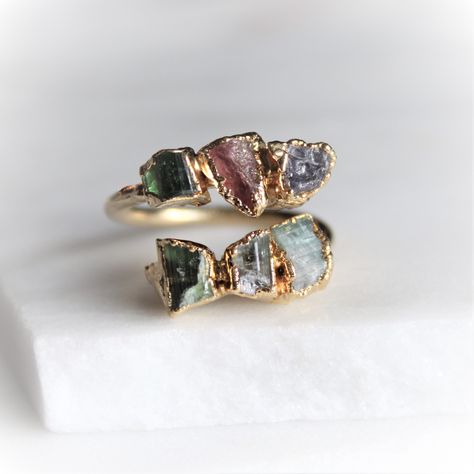 Raw tourmaline dipped in 18k gold. Nature is a strong force flowing through our jewelry. We let the raw gemstones do the talking. Each unique stone determines the shape and style each design will take on. In return, we achieve an organic and luxe feel. All of our jewelry is one of a kind. ::The process of gold dipping:: Handpicked stones are arranged and set in copper. A generous layer of 18k gold is then applied. ♥ Thank you for shopping Cocolina ♥ Metal Clay Designs, Raw Tourmaline Ring, Raw Tourmaline, Raw Stone Jewelry, Raw Gemstone Jewelry, Raw Gemstone Ring, Raw Stone Ring, Layered Rings, Cuff Ring