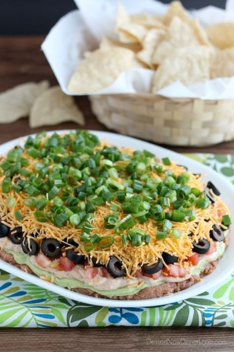 Seven Layer Dip is a classic party snack or football food. This version has a secret ingredient to make it a dip that is sure to get gobbled up by your guests. Seven Layer Dip Recipe, Tex Mex Dip, Easter Vegetables, Layer Dip Recipe, Shortcake Cookies, Veggie Appetizers, Layered Dip Recipes, Seven Layer Dip, Easter Appetizers