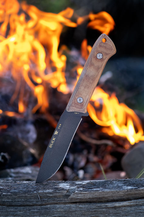 The Buck Compadre fixed blade knife sticking out of a log in front of a campfire. Buck Knives, Camping Knife, Camping Tools, Camping Activities, Camp Knife, Knife Handles, Fixed Blade Knife, Hunting Knife, Knife Making