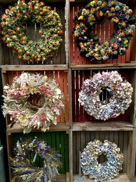 Wreath display at Terrain 8-25-13 Terrain Christmas, Christmas Merchandising, Craft Show Display Ideas, Show Display Ideas, Fresh Wreaths, Wreath Display, Craft Fair Booth Display, Craft Show Booths, Craft Show Booth