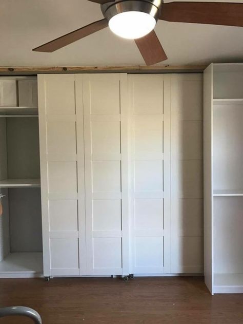 BERGSBO doors made into sliding barn doors -front view (of sliding BILLY bookcase in front of closet). the bottom 4 sliding wheels of the bookcase is hidden by the toekick of the bookcase. Ikea Sliding Door, Cheap Barn Doors, Bedroom Ikea, Billy Ikea, Sliding Door Wardrobe Designs, Billy Bookcases, Hack Ikea, Ikea Closet, Ikea Pax Wardrobe