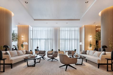 Hotel design, Lulie Fisher Design Studio, Vida Hotel, Dubai Hotel Lounge Area, White Marble Bar, Interior Design Studios, Emirates Hills, Pastel Furniture, Hotel In Dubai, Hidden Lighting, Communal Table, Lobby Lounge