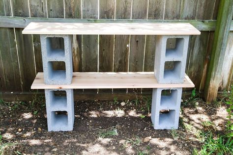 This is such a simple project, and it's actually kind of a classic from 80's college dorms, but if you plop some plants on it, suddenly it looks a lot more chic and fits right into your backyard! I love these shelves to hold flowers, herbs, and gardening tools! You can see this project and more easy and affordable DIY ideas on my blog,  Love & Renovations Start by grabbing two of your cinder blocks and laying them out where you're working about 3 feet apart from one another. I highly r… Cinder Block Shelf, Cinder Block Shelves, Large Wooden Planters, Woodworking Studio, Cinder Blocks, Recycle Timber, Garden Shelves, Diy Planter Box, Window Planters