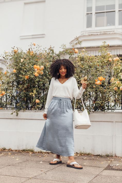 Light blue satin skirt and white cardigan Blue Satin Skirt, Long Satin Skirt, Blue And White Outfits, Slip Dress Outfit, Transition Outfits, Satin Midi Skirt, White Outfit, White Sandals, Satin Skirt