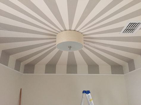 Circus tent ceiling in nursery painted by my husband with help from a laser beam Painted Ceiling Nursery, Playroom Ceiling Ideas, Circus Ceiling, Circus Ceiling Paint, Nursery Circus, Vintage Circus Room Decor, Circus Baby Room, Circus Tent Ceiling, Striped Ceiling