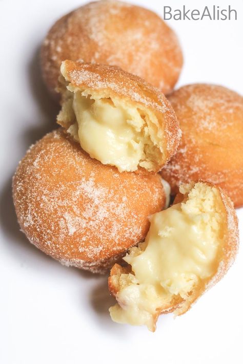 These Vanilla Custard Filled Donuts are also called Bomboloni. A soft and fluffy doughnut recipe with pastry cream filling on the inside Custard Filled Donuts Recipe, Soft Custard Rolls, Cream For Donut Filling, Maple Cream Filled Doughnut, Custard Doughnut Recipe, Bakery Doughnut Recipe, Filling For Donuts Recipes For, Lemon Filled Donuts Recipe, Creme Filled Donut Recipe