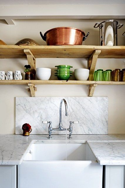 Old elm pieces were used to craft the shelves above the Carrara-marble-topped units. 1700s Home, Avocado Bathroom Suite, Cotswold Cottage, Cotswolds Cottage, Inside A House, Scandinavian Chairs, Terence Conran, Country Retreat, Cottage House