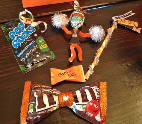 Cheer candy gifts.  You rock pop rocks,  Pixie stix spirit stix, blow pop cheerleader, bow m&m's Cheer Blow Pops, Blow Pop Cheerleader, Cheer Candy Gifts, Cheer Spirit Gifts, Cheer Goodie Bags, Diy Cheer Gifts, Cheer Favors, Cheerleading Snacks, Cheer Gifts Diy