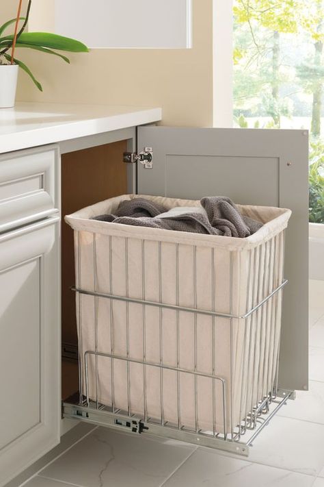 Have a hamper right where you need it, yet tucked away inside a cabinet out of sight, but not out of mind. Bathroom Laundry Baskets, Hidden Laundry, Room Storage Diy, Bathroom Closet, Laundry Room Storage, Trendy Bathroom, Laundry Storage, Large Bathrooms, Laundry Room Design