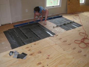 How to Level a Plywood or OSB Subfloor Using Asphalt Shingles & Construction Felt - One Project Closer Leveling Subfloor Plywood, Best Flooring For Uneven Floors, Flooring For Uneven Floors, Floor Leveling, Leveling Floor, Plywood Floors, Plywood Subfloor, Strand Board, Flooring Diy