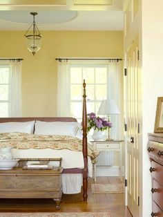 Winter Brights In a part of the country known for dark and dreary winters, using color to lighten spaces is a no-brainer. This Vermont farmhouse?s master bedroom gets its glow on with walls in buttery yellow and trim in off-white. The combination can brighten even the darkest winter day. Colors For North Facing Bedroom, Yellow Floral Bedroom, Yellow Farmhouse Bedroom, Yellow House Aesthetic, Yellow Farmhouse Kitchen, Yellow Bedroom Aesthetic, Light Yellow Bedrooms, Sunflower Bedroom, Dresser Ikea