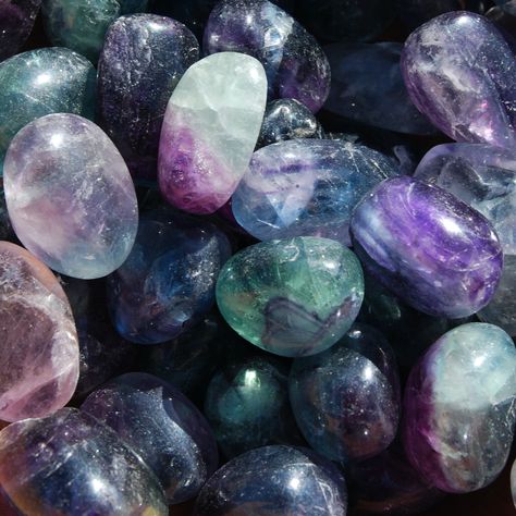 Natural medium fancy rainbow Fluorite tumbled stones. This type is full of magenta, blue and watermelon tumbled fluorite crystals. They measure approximately .75 to 1.25 inches.Fluorite is a stone of Intellect. Absorbs and neutralized stress and negative energy. Increases self confidence and concentration. It is a grounding stone that increases intuition. Cleanses the Chakras. Stimulates creativity.Chakra: Third Eye ❤︎ Follow us on Instagram to keep updated on sales and have first dibs on new pr Flourite Stone Aesthetic, Rainbow Fluorite Aesthetic, Fluorite Crystal Aesthetic, Fluorite Aesthetic, Crystals Pictures, Pretty Crystals, Crystal Photography, Tumbled Crystals, Fluorite Gemstone