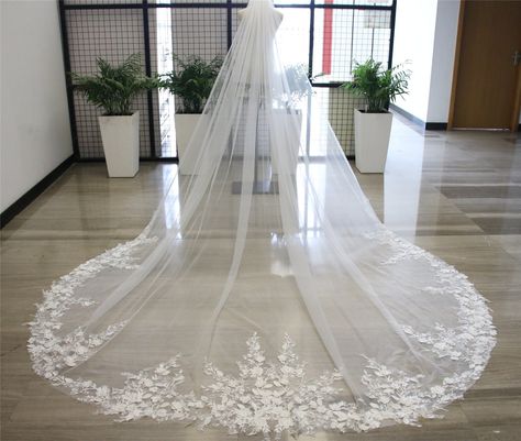 "Wedding Veil  Color: white, ivory, beige, champagne Fabric: tulle, lace, beads Applicable scene:wedding  Length: shoulder 20\"   elbow 26\"  waist 30\"  hip 33\"  fingertip 36\"  knee 45\"  waltz 54\"     floor 72\"  chapel 90 \"  church 100\"   cathedral 118 \"   royal 137\"  regal 157\"                                                                                                                              The veil comes with a comb. The veil is made of tulle, I think you might like it. You'll look elegant in it. The wedding veils we make are the same as the pictures. Marriage is a very important thing, I think you must want to have a perfect wedding, hope to buy a perfect veil. You can consider choosing us, we will provide you with the best quality service. If you don't know how to Applique Veil, Wedding Veil With Lace, Long Bridal Veil, Veil Color, Champagne Fabric, Blue Wedding Gowns, Veil Comb, Veil With Lace, Custom Veil