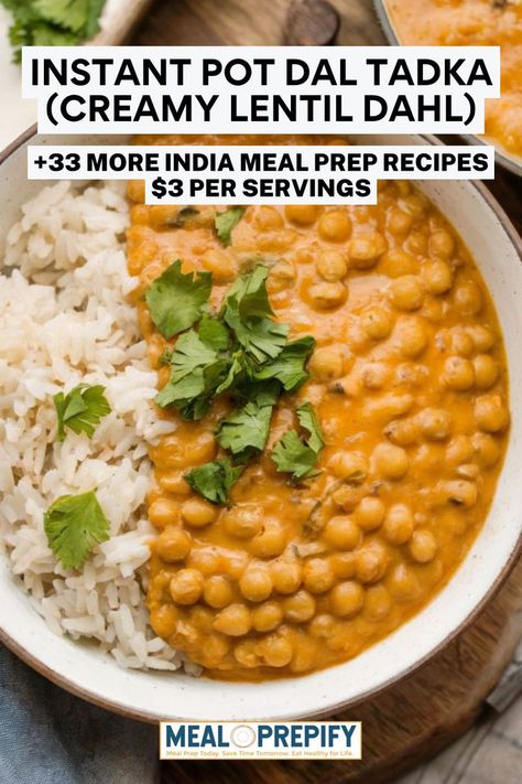 A creamy, golden-hued lentil dish served with white rice and garnished with fresh cilantro on a rustic wooden table. Indian Meal Prep, Instant Pot Dal, Food Recipes Meal Prep, Dal Tadka, Lentil Dahl, Indian Meal, Recipes Meal Prep, Hearty Meal, Recipes Indian