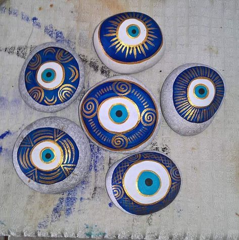 Evil Eye Rocks Painted Stones, Evil Eye Painted Rocks, Evil Eye Rock Painting, Evil Eye Art, Whimsical Art Paintings, Diy Rock Art, Stone Art Painting, Seashell Painting, Evil Eye Design