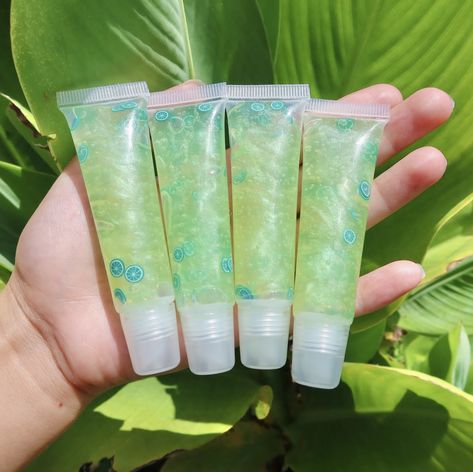 Green Makeup Products Aesthetic, Green Aesthetic Perfume, Lipgloss Business Aesthetic, Green Lip Gloss Aesthetic, Purple Lipgloss Aesthetic, Green Mojito, Facebook Aesthetic, Green Lips, Glossier Lip Gloss