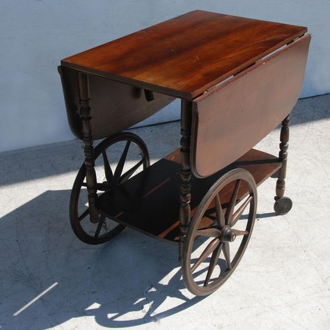 (18"- 40") Vintage drop leaf wood bar table cart. Features functional wheels.  With leaves open: 40" Width 1940s Furniture, Wood Bar Cart, Wood Bar Table, Tea Cart, Serving Table, Vintage Things, Wood Bar, Oldies But Goodies, Anne Frank