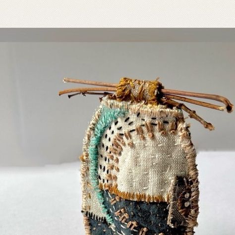 Marly Penner on Instagram: ""Winter Vessel" approx. 2.5"x 3" or 6cm x8 cm, using recycled fabric, added stitch, and a fabric "bead lid" with wrapped vine and big maple leaf stems.  I had some of the stitched collage panel left over from the purse shown in the previous post, so I made this tiny vessel. Swipe to see other side and original stitched collage panel. . . .  #textilecollage#stitchedcollage#fibrecollage#contemporarytextileart#contemporarystitch#textilevessel#fabricvessel#dailystitching" Stitch Pots, Fabric Vessels, Stitched Collage, Recycled Fabric Art, Christmas Fabric Crafts, Diy Fabric Jewellery, Stitch Witchery, Fiber Art Jewelry, Scrap Fabric Crafts