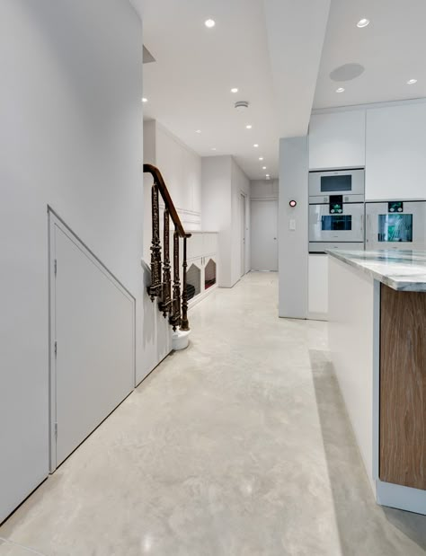 Concrete doesn't have to be grey. This Oyster White Lazenby Polished Concrete floor with its mottled appearance creates a beautiful feature within a beautifully designed kitchen. White Stain Concrete Floor, Oyster White Concrete Floors, Polished White Concrete Floors, White Concrete Floors Living Room, White Stained Concrete Floors, White Polished Concrete Floor, Light Stained Concrete Floors, White Cement Floor, Polished Concrete Floor Kitchen