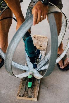 Here is a fun and easy craft to add some zest to your garden (or really anywhere in your home). Simply grab some old wine barrel rings and you can add some industrial rustic edge to your space. I snagged these rings at the swap meet for pretty inexpensive but you can also find them online on Craigslist pretty often too. You can even buy a wine barrel and that is a whole barrel of crafts that will certainly keep you busy!! I made a few of these and placed them around the entry to our ho… Wine Barrel Diy, Wine Barrel Garden, Garden Diy Decoration Ideas, Rustic Outdoor Lighting, Barrels Diy, Wine Barrel Rings, The Swap, Swap Meet, Barrel Rings