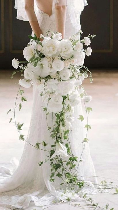 No 3 Long free-flowing cascade | 2022 Wedding Bouquet Trends Greenery Wedding Bouquet, Natural Bouquet, Cascading Bridal Bouquets, Cascading Wedding Bouquets, Spring Wedding Bouquet, Spring Wedding Flowers, Cascade Bouquet, White Wedding Bouquets, A Wedding Dress