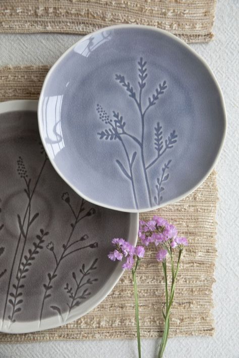 Debossed with plants patterns and made of stoneware in crackle glaze, the Floral Lovers Plate Collection is the elegant choice for your dining table. Also with organic vessel shapes, it looks more natural and stunning. Inspired by romantic lavenders, the color we chose for it is soft violet or soft brown, delivering you a mild sense. Ceramics Pottery Vase, Beginner Pottery, Clay Plates, Plate Collection, Ceramic Workshop, Pottery Handbuilding, Diy Ceramic, Wheel Thrown Pottery, Pottery Crafts