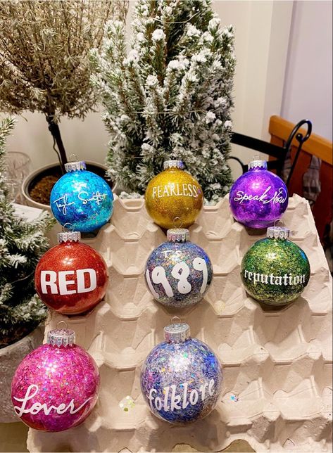 Homemade Taylor Swift Christmas Tree Ornaments #taylorswift #christmasdecor #christmas #fearless #speaknow #red #1989 #reputation #lover #folklore #taylorswiftreputation #taylorswiftlover #swiftie #swifty #handmade #handmadehomedecor #homedecorideas #cricut #cricutmade #cricutmakerprojects Homemade Taylor Swift Merch, Taylor Swift Baubles, Taylor Swift Eras Tour Ornament, Christmas Gifts For Taylor Swift Fans, Taylor Swift Tree Ideas, Taylor Swift Gift Ideas Christmas, Taylor Swift Lover Gift Ideas, Homemade Taylor Swift Ornaments, Taylor Swift Christmas Ideas