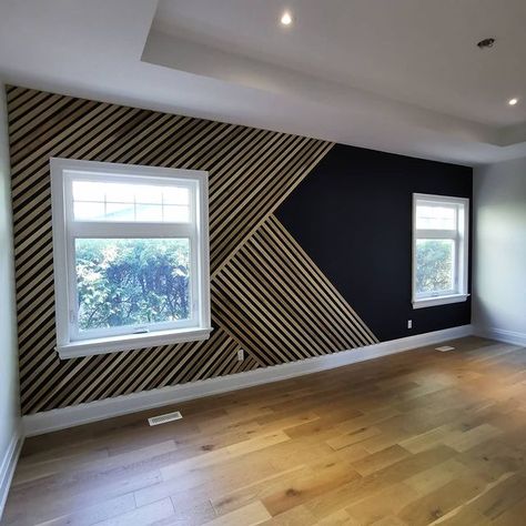 Now this is an accent wall! Over 25 ft long and painted in Onyx Black. We used our "classic" geometric design with slight twist to… Accent Wall Ideas Living Room, Trim Accent Wall Ideas, Wood Trim Accent Wall, Accent Wall Hallway, Trim Accent Wall, Vertical Slats Wall, Accent Wall Design, Vertical Slats, Integrated Lighting