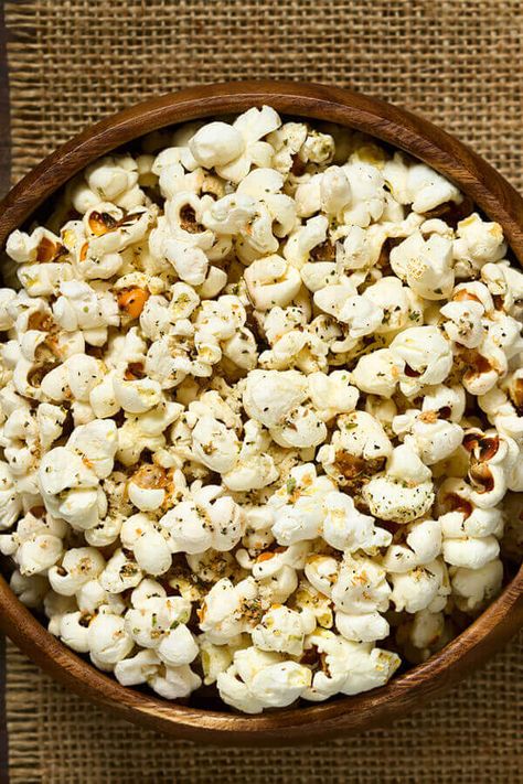 Mediterranean Magic Popcorn - Popcorn is one of the absolute easiest foods to upgrade. Olive oil and parmesan turn fresh popped popcorn into a movie night creation that'll keep you snacking away guilt free. Made with microwave popcorn, olive oil, Italian seasoning blend, Parmesan cheese | CDKitchen.com Olive Oil Popcorn, Party Snacks Easy Appetizers, Italian Seasoning Blend, Mediterranean Snacks, Mediterranean Diet Food List, Healthy Popcorn, Party Snacks Easy, Movie Night Snacks, Popcorn Snacks